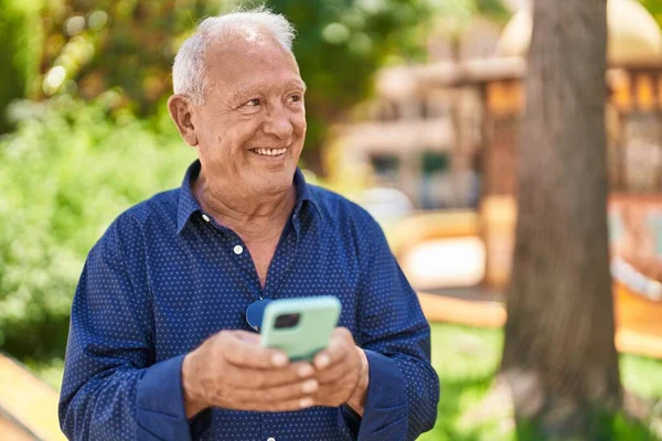 Senior Grey Haired Man Smiling Confident Using Smartphone Park — 图库照片