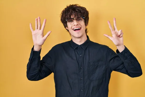 Young Man Wearing Glasses Yellow Background Showing Pointing Fingers Number — Stock Photo, Image