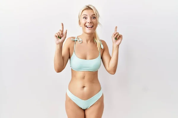 Young Caucasian Woman Wearing Bikini Isolated Background Smiling Amazed Surprised — Stockfoto