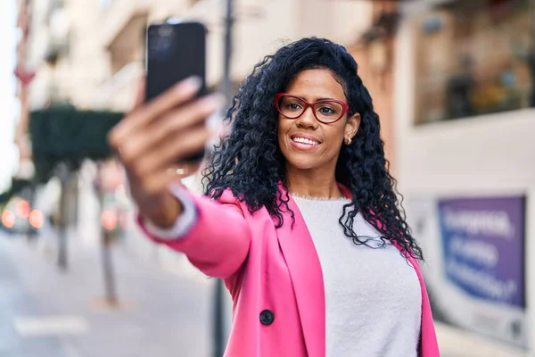 African american woman executive make selfie by the smartphone at street