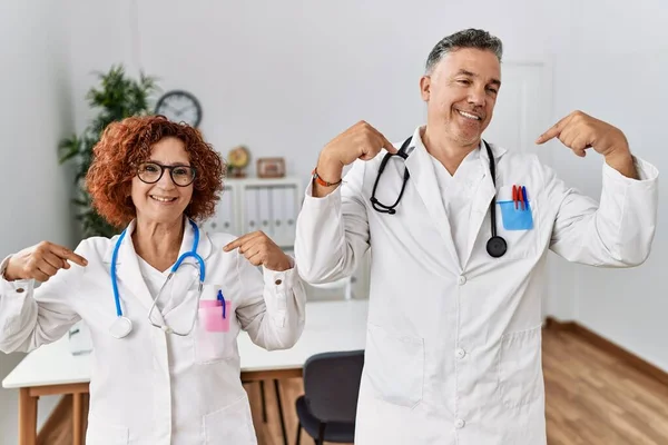 Two Middle Age Doctors Medical Clinic Looking Confident Smile Face — Fotografia de Stock