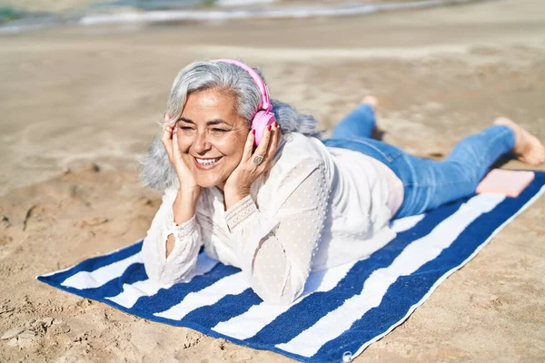 Middle Age Woman Listening Music Lying Towel Seaside — Foto de Stock