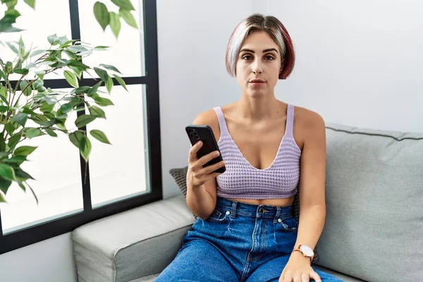 Young Beautiful Woman Using Smartphone Typing Message Sitting Sofa Relaxed — Stok fotoğraf