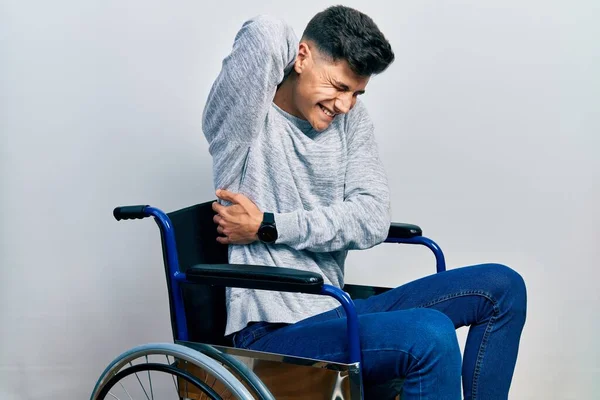 Young Hispanic Man Sitting Wheelchair Suffering Neck Ache Injury Touching — Stok fotoğraf