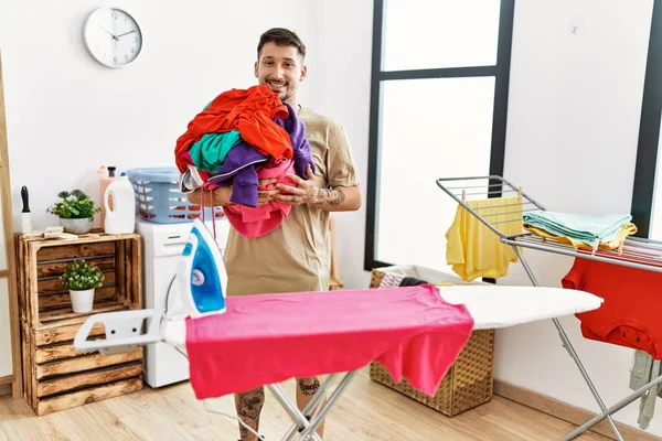 Young Handsome Man Holding Laundry Ready Iron Looking Positive Happy —  Fotos de Stock