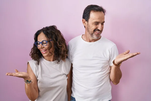 Middle Age Hispanic Couple Together Pink Background Smiling Showing Both —  Fotos de Stock