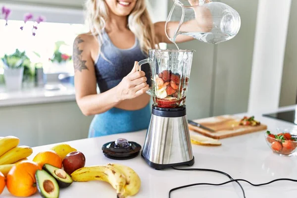 Young Woman Smiling Confident Pouring Water Blender Kitchen — Stok fotoğraf