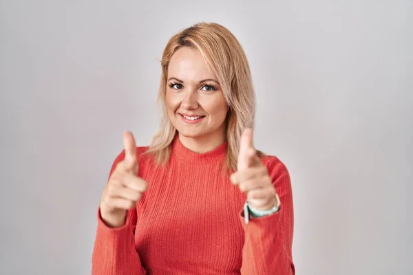 Blonde Woman Standing Isolated Background Pointing Fingers Camera Happy Funny — Zdjęcie stockowe
