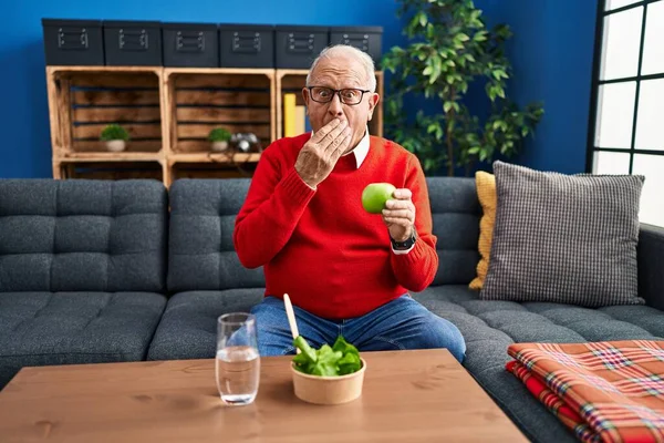 Senior Man Grey Hair Eating Salad Green Apple Covering Mouth — Stockfoto