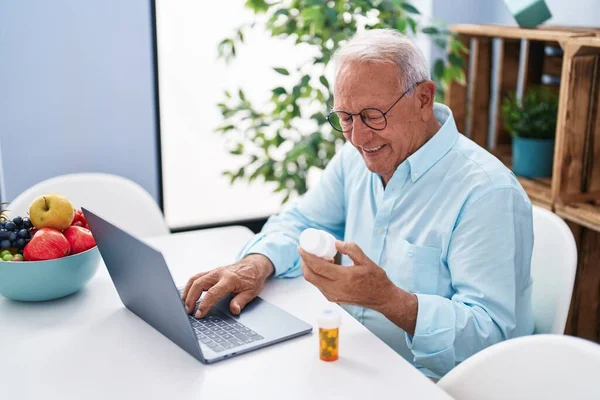 Senior Grey Haired Man Having Telemedicine Sitting Table Home — Stock fotografie