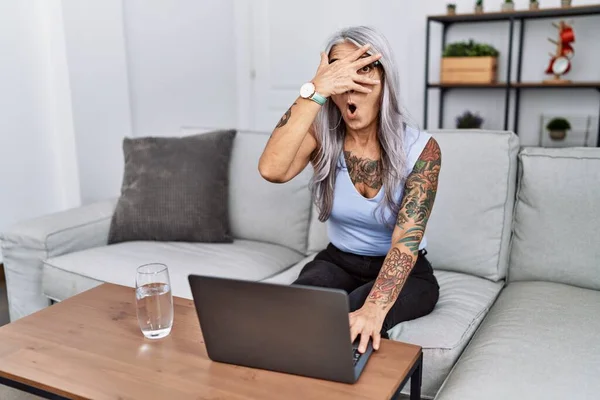 Middle Age Grey Haired Woman Using Laptop Home Peeking Shock — Foto de Stock