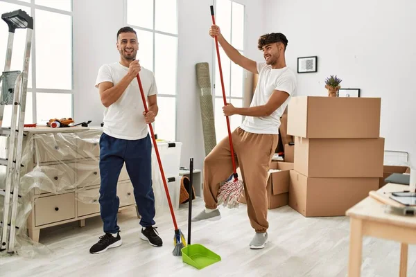 Two Hispanic Men Couple Cleaning Dancing New Home — Stock Photo, Image