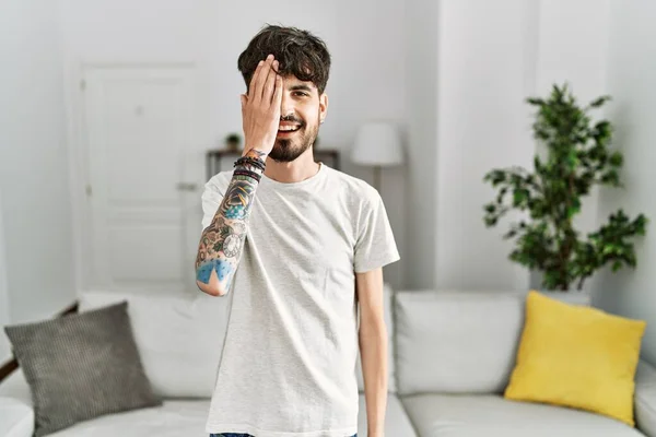 Hispanic Man Beard Living Room Home Covering One Eye Hand — Stockfoto