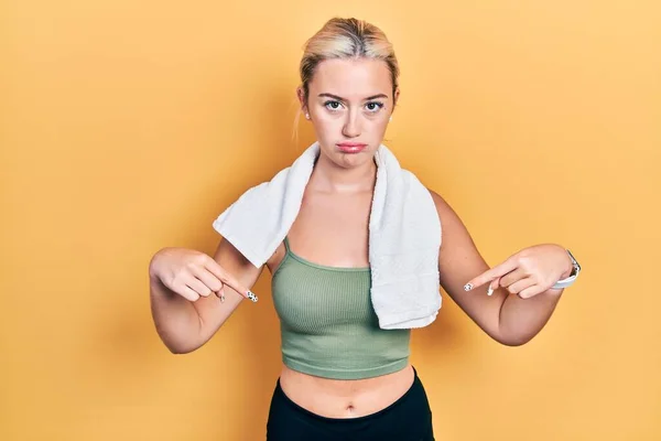 Young Blonde Girl Wearing Sportswear Towel Pointing Looking Sad Upset — Stock Photo, Image