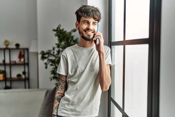 Young Hispanic Man Smiling Confident Talking Smartphone Home — Fotografia de Stock