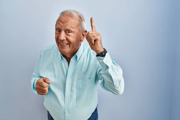 Senior Man Grey Hair Standing Blue Background Pointing Finger Successful — Stock Photo, Image