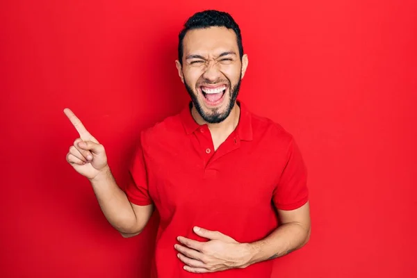 Hispanic Man Beard Pointing Fingers Side Smiling Laughing Hard Out — Stok fotoğraf