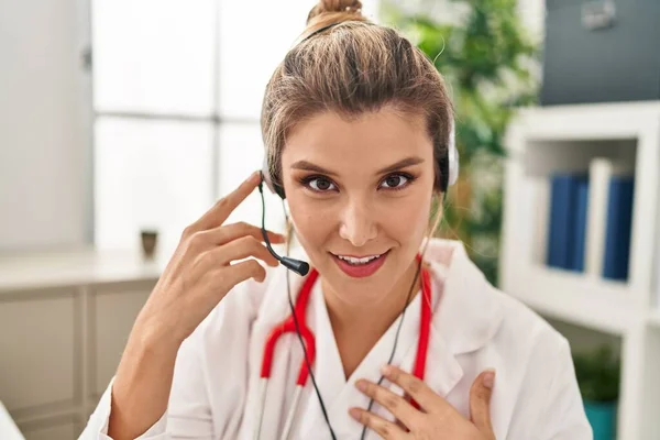 Young Blonde Woman Wearing Doctor Uniform Having Teleconsultation Clinic — Stock fotografie