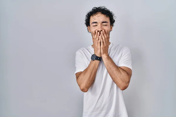 Hispanic Man Standing Isolated Background Laughing Embarrassed Giggle Covering Mouth — Fotografia de Stock