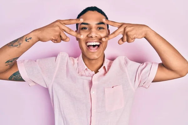Young African American Guy Doing Victory Sign Peace Gesture Celebrating — Stock Photo, Image
