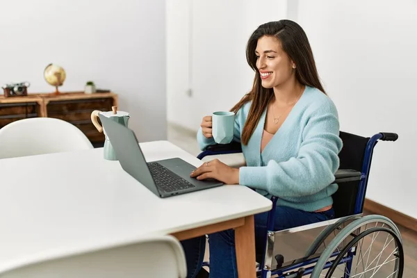 Young Woman Drinking Coffee Sitting Wheelchair Working Home — Stok fotoğraf