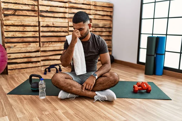 Young Indian Man Sitting Training Mat Gym Tired Rubbing Nose — Stok fotoğraf