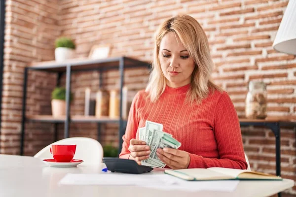 Young Blonde Woman Sitting Table Counting Dollars Home — 스톡 사진