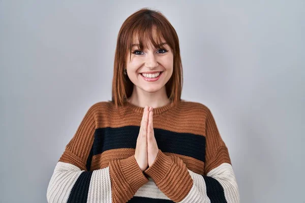 Young Beautiful Woman Wearing Striped Sweater Isolated Background Praying Hands — Stock Photo, Image