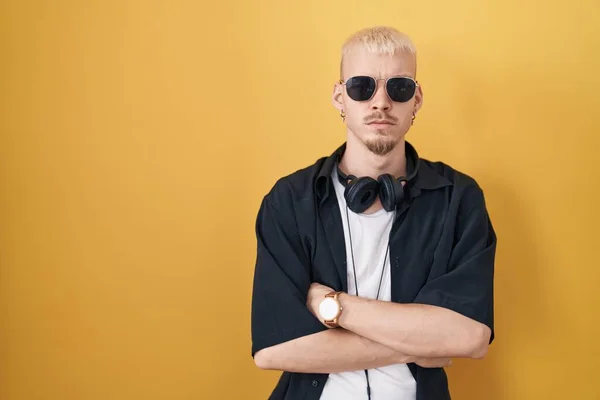 Young Caucasian Man Wearing Sunglasses Standing Yellow Background Skeptic Nervous —  Fotos de Stock