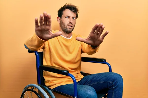 Handsome Man Beard Sitting Wheelchair Doing Stop Gesture Hands Palms — Stock Photo, Image