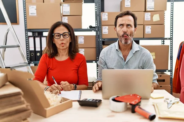Middle Age Couple Working Small Business Ecommerce Making Fish Face —  Fotos de Stock