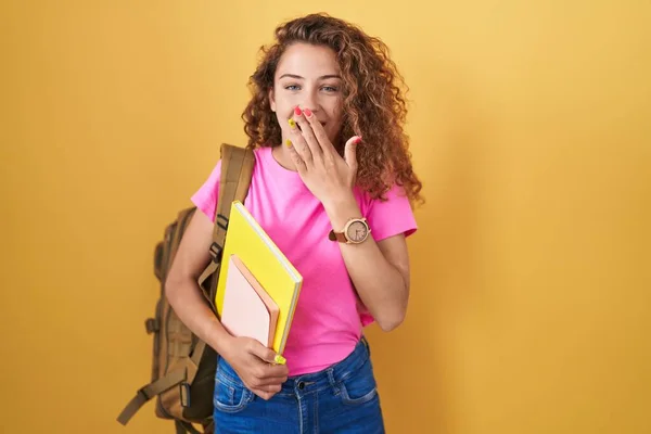 Young Caucasian Woman Wearing Student Backpack Holding Books Laughing Embarrassed — Stock Photo, Image