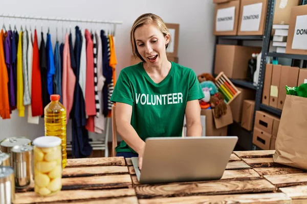 Young Caucasian Woman Wearing Volunteer Uniform Having Video Call Working — Stok fotoğraf