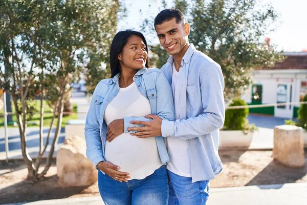 Young Latin Couple Expecting Baby Hugging Each Other Standing Park — 图库照片