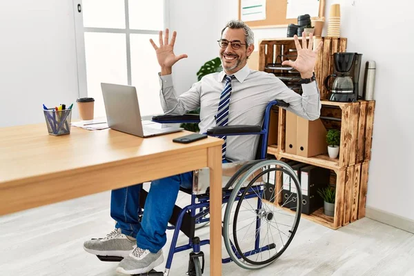 Middle Age Hispanic Man Working Office Sitting Wheelchair Showing Pointing — Stock Photo, Image