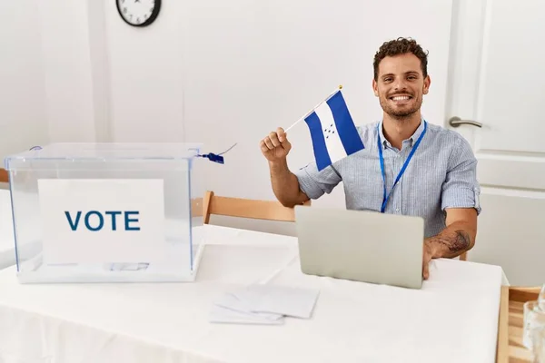 Young Hispanic Man Smiling Confident Holding Honduras Flag Working Electoral — Stock Photo, Image