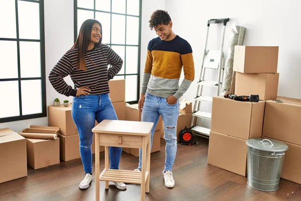 Young Latin Couple Smiling Happy Assembling Piece Furniture New Home — Foto de Stock