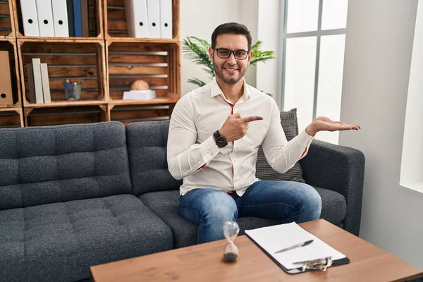 Young Hispanic Man Beard Working Consultation Office Amazed Smiling Camera — Stock Photo, Image
