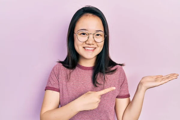 Young Chinese Girl Wearing Casual Clothes Glasses Amazed Smiling Camera — Fotografia de Stock