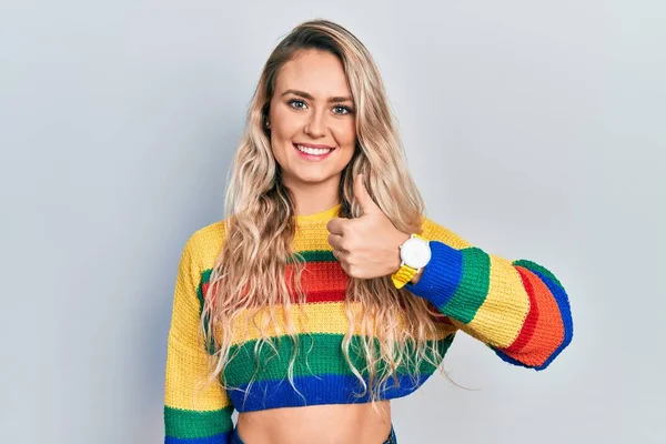 Beautiful Young Blonde Woman Wearing Colored Sweater Doing Happy Thumbs — Zdjęcie stockowe