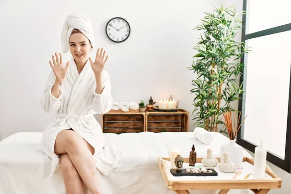 Young Blonde Woman Wearing Bathrobe Wellbeing Spa Showing Pointing Fingers — Foto de Stock