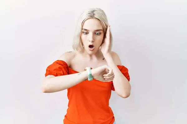 Young Caucasian Woman Standing Isolated Background Looking Watch Time Worried — Stok fotoğraf