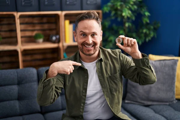 Middle Age Caucasian Man Holding Virtual Currency Bitcoin Pointing Finger — Stock Fotó