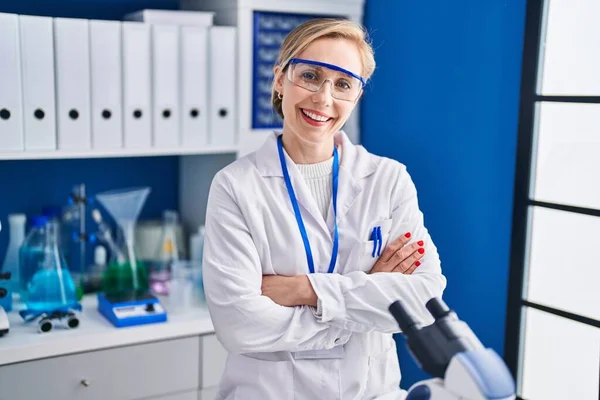 Young Blonde Woman Scientist Smiling Confident Standing Arms Crossed Gesture — Stock Fotó