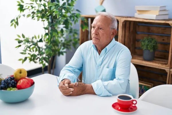 Senior Grey Haired Man Drinking Coffee Sitting Table Home — Zdjęcie stockowe