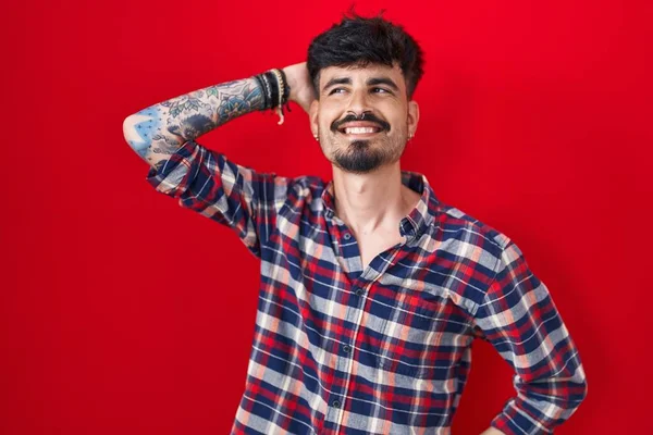 Young Hispanic Man Beard Standing Red Background Smiling Confident Touching — Foto Stock