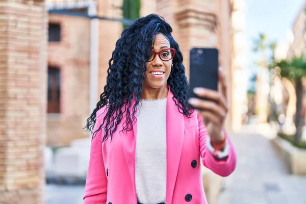 African american woman executive make selfie by the smartphone at street