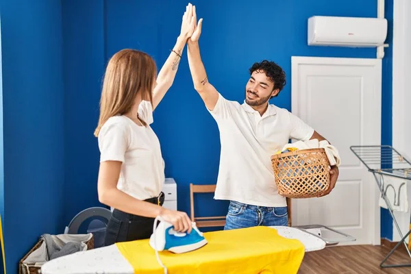 Man Woman Couple High Five Hands Raised Ironing Laundry Room — Zdjęcie stockowe