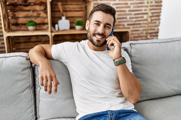 Young Hispanic Man Smiling Confident Talking Smartphone Home — Stok fotoğraf
