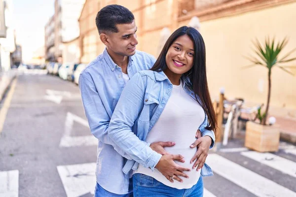Young Latin Couple Expecting Baby Hugging Each Other Standing Street — Foto de Stock